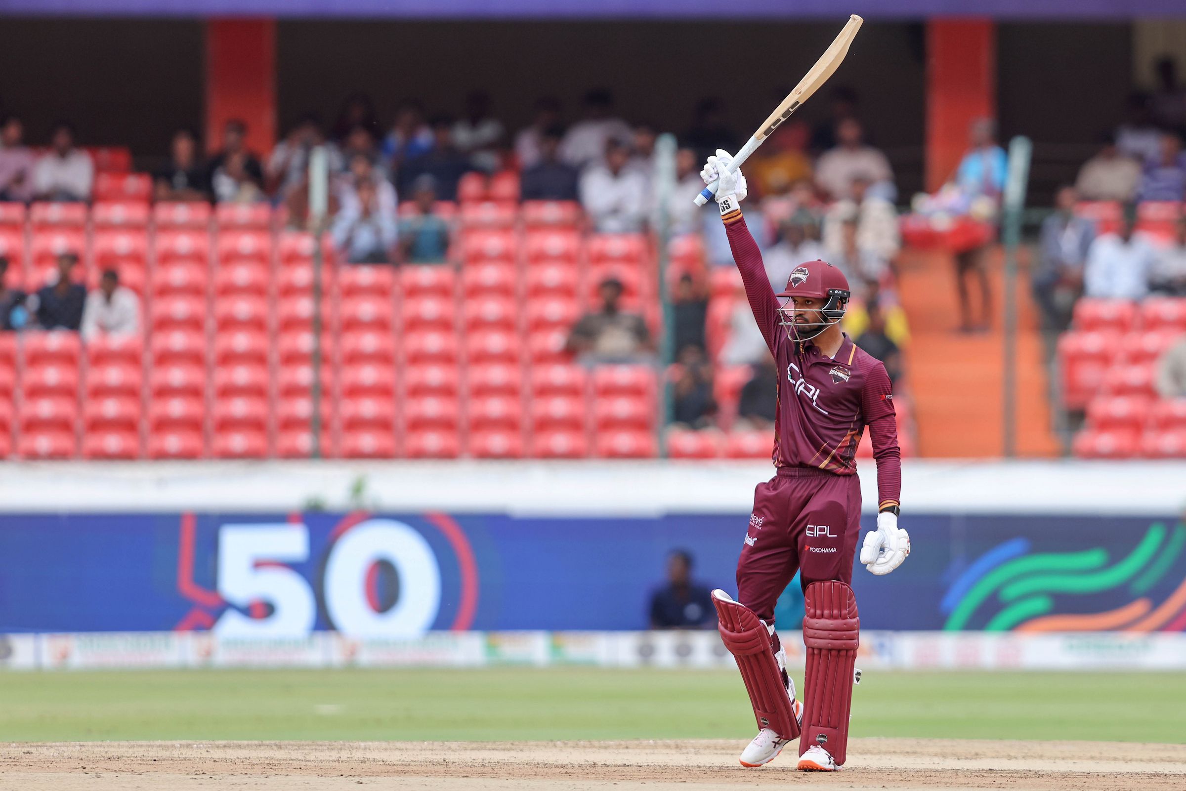 Rahul Radesh of EIPL and Eleve Karimnagar Diamonds raises his bat after scoring a fifty during Match 20