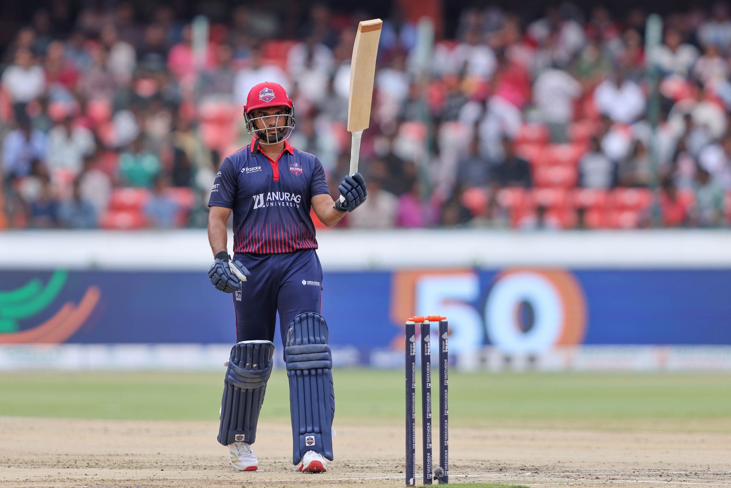Patkuri Nitish Reddy of Anurag Nalgonda Knights raises his bat after scoring a fifty during the Match 10 of the Sreenidhi University TG20 between Anurag Nalgonda Knights and Warangal Warriors